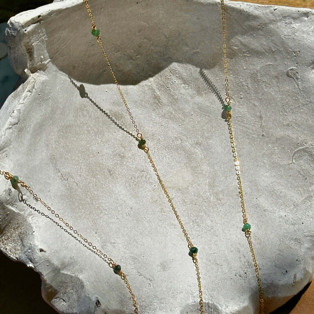 Emerald Gemstone Chain on a Rock