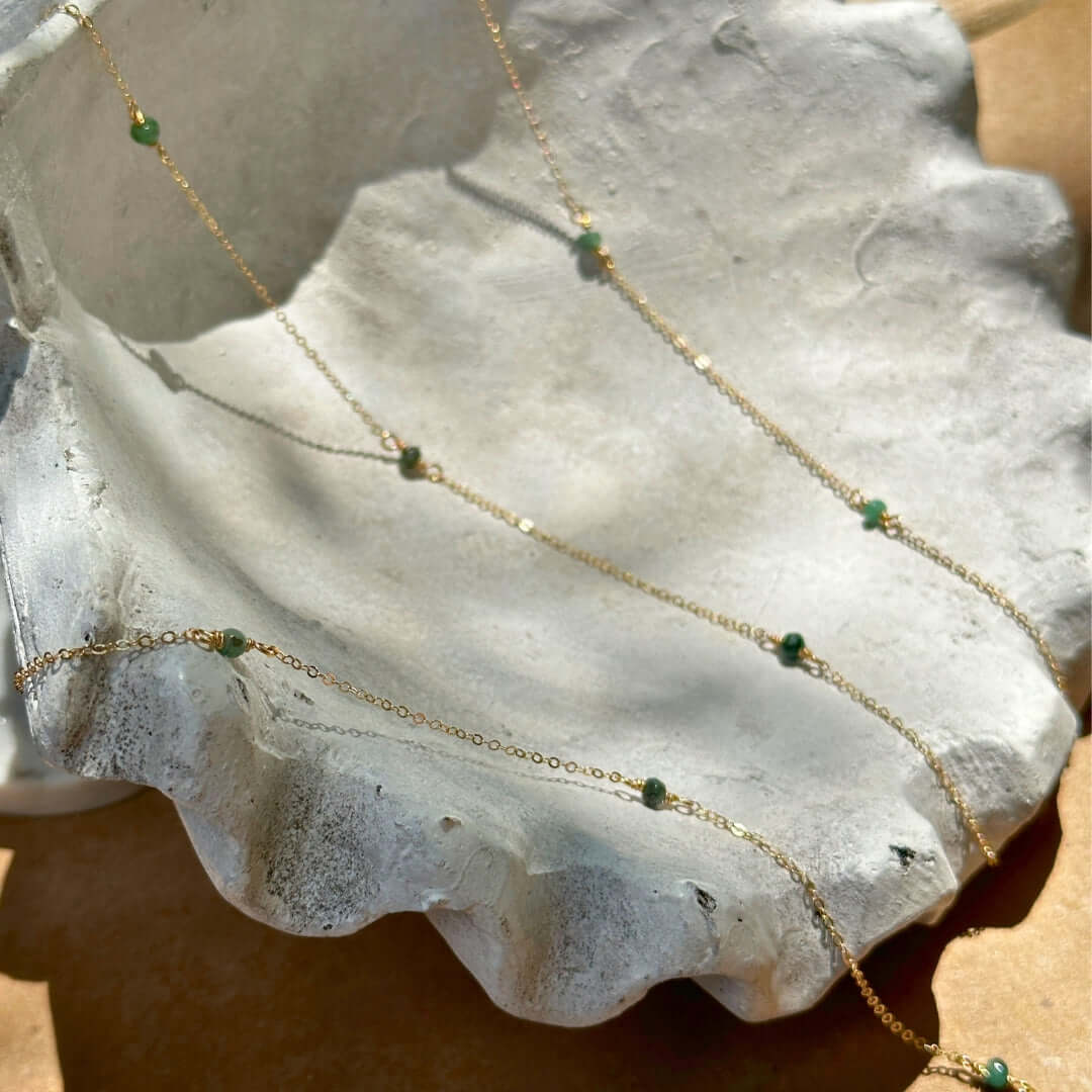 Emerald Gemstone Chain on a Rock