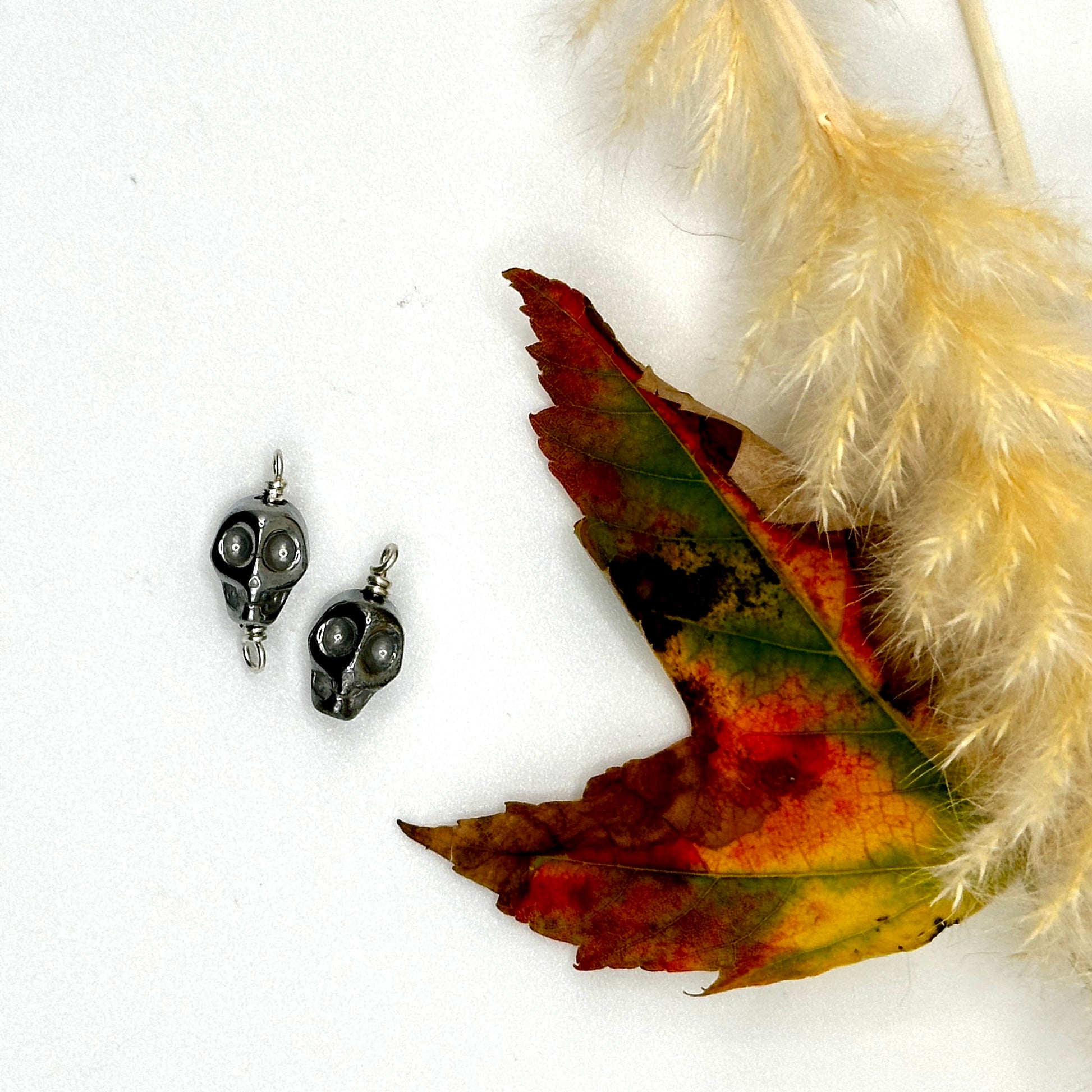 Titanium Hematite Carved Skull Charms & Connectors