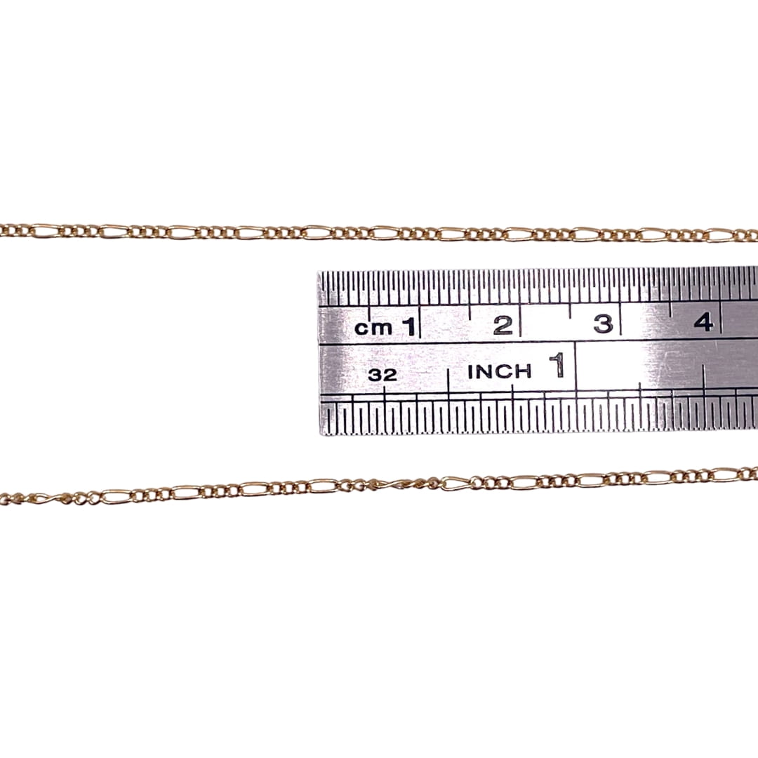 14k Gold Filled Figaro chain actual measurement using a ruler.