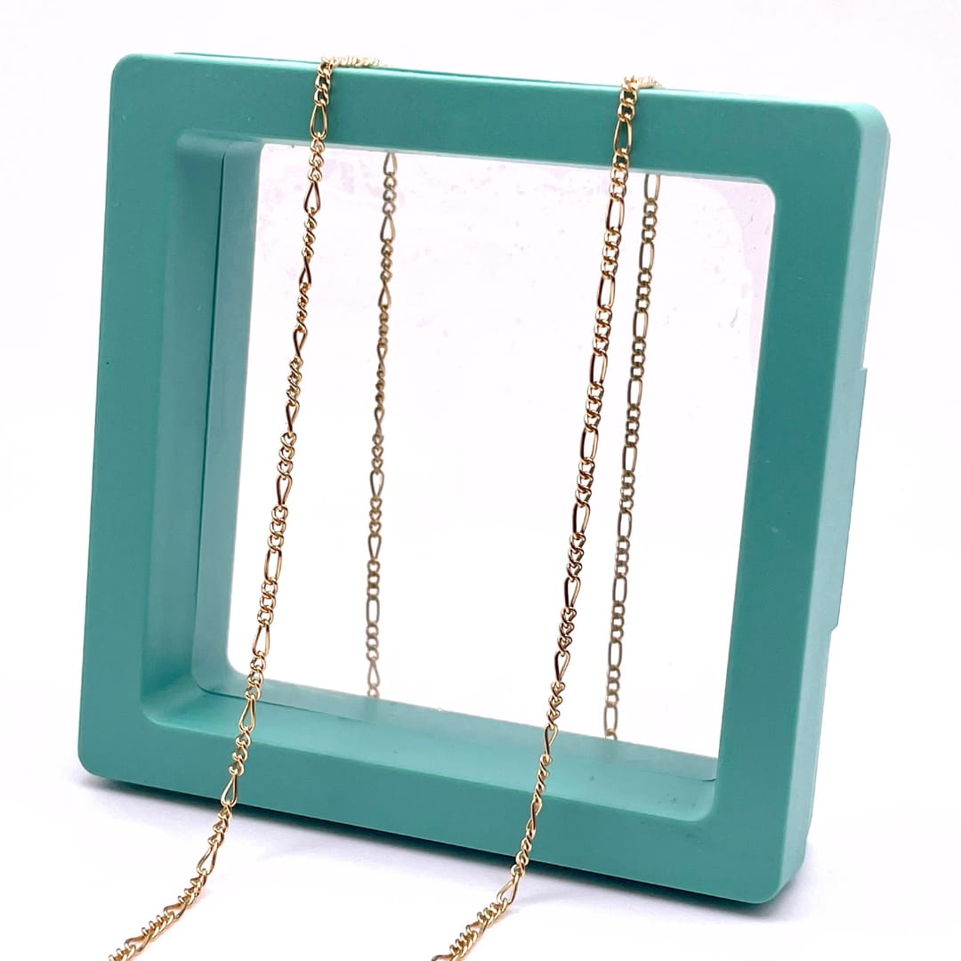 14k Gold Filled Figaro chain for permanent jewelry in a green hallow box.