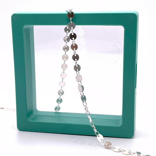 Sterling silver round sequin disk chain for permanent jewelry in a hallow box.