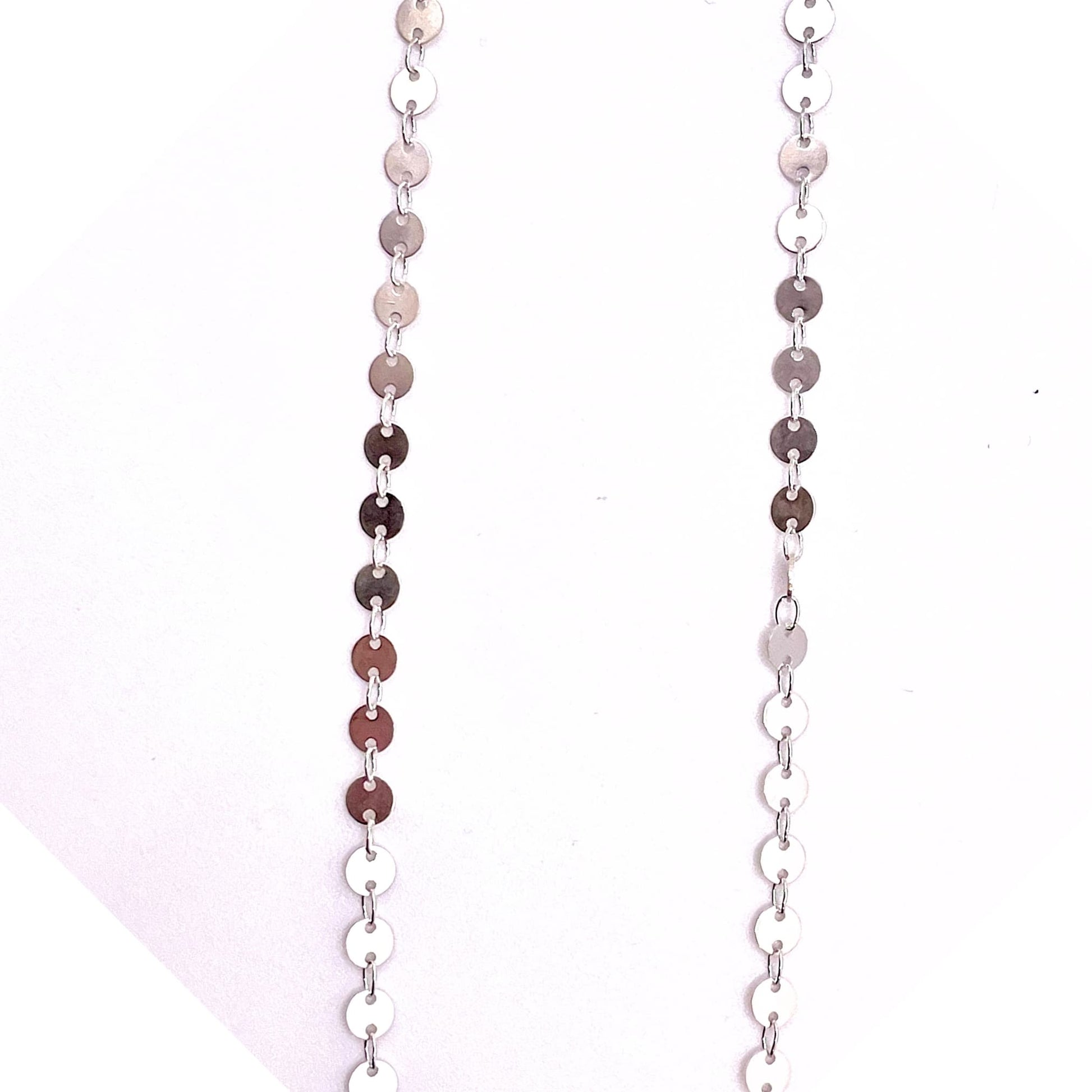 Stretched round sequin disk chain for permanent jewelry.