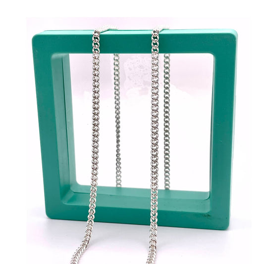 925 sterling silver curb chain for permanent jewelry in a green hallow box.